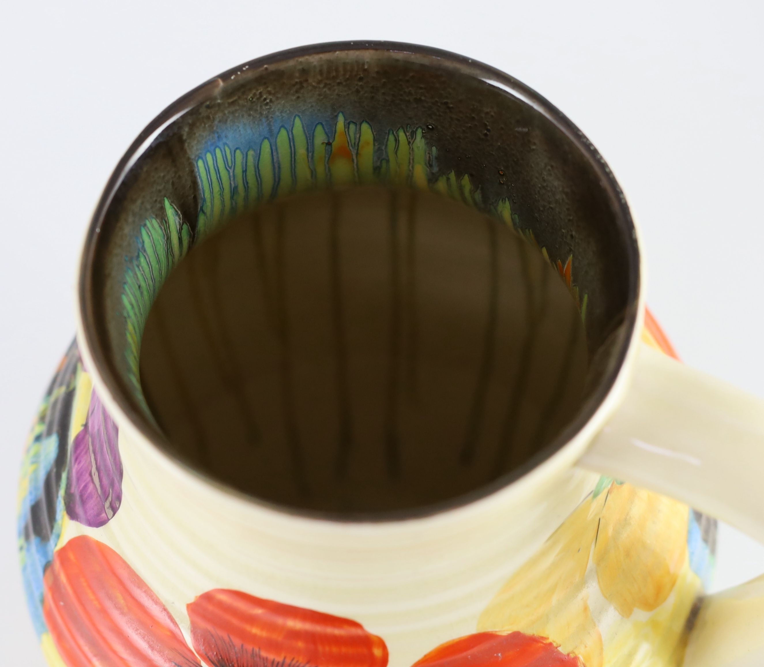 A Clarice Cliff Delecia Poppy jug, 29.5cm high